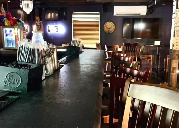 The upstairs bar as it was handed over, dollar bills still stapled to the beams