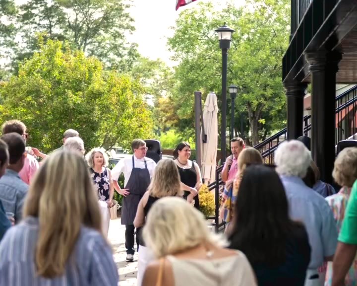 Midtown Columbus gathered on the sidewalk outside for the opening