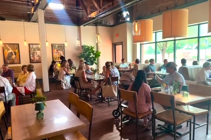 The dining room at Lou Lou's, full at lunchtime under the timber trusses