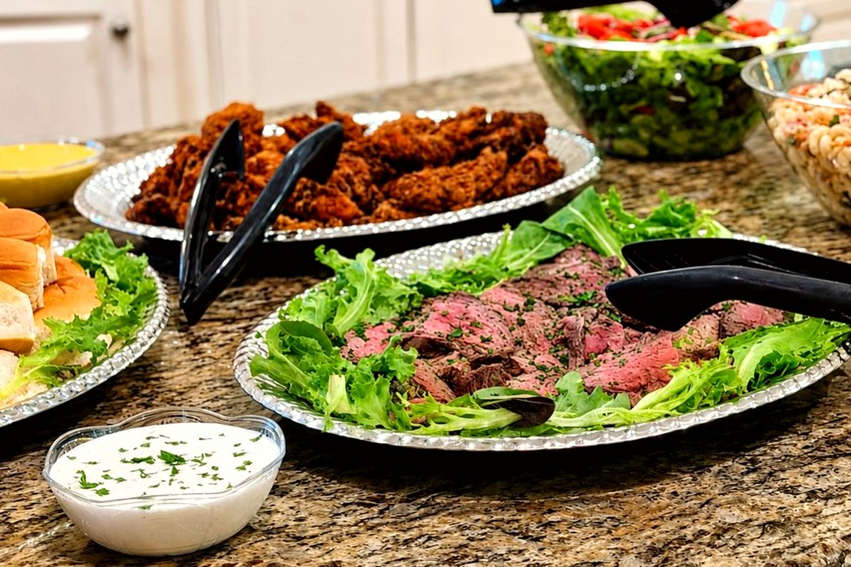 A catering spread laid out on a granite counter