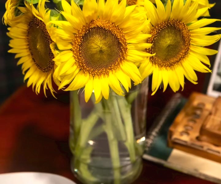 Sunflowers on the table by the guest book