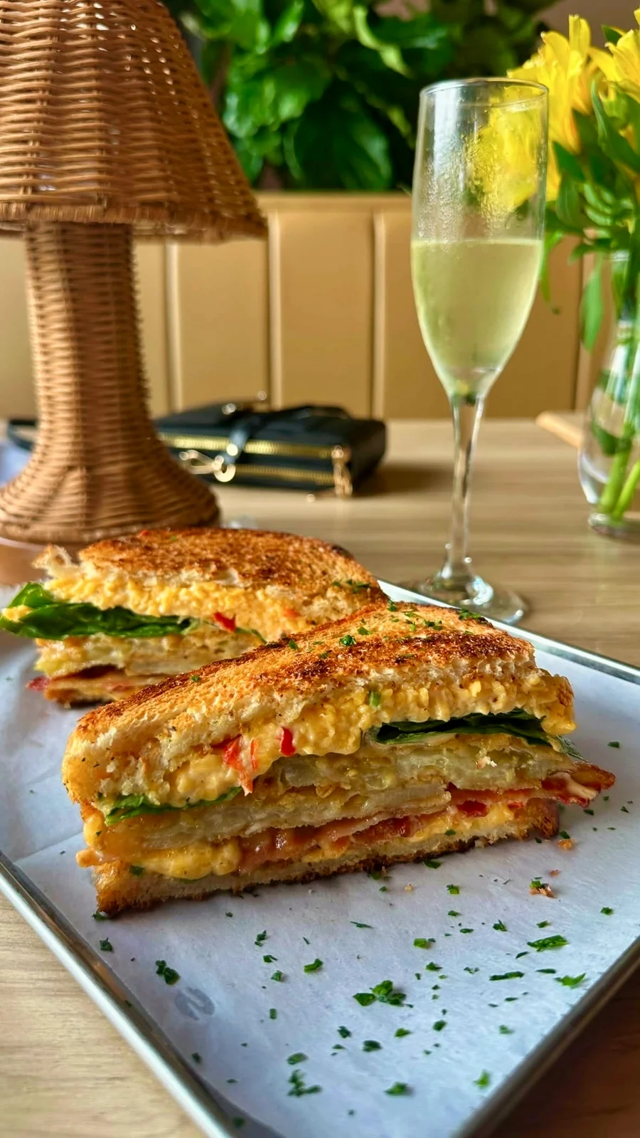A panini cut through, with a glass beside it