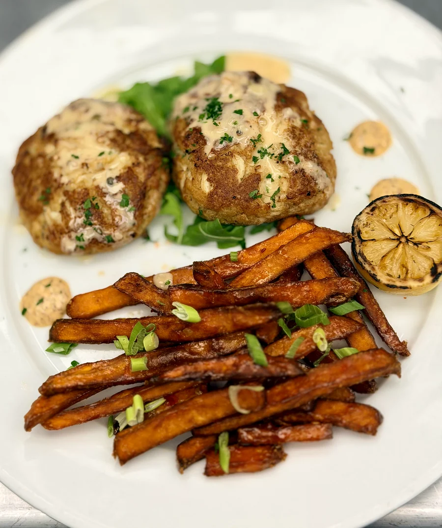 Chesapeake crab cakes, sweet potato fries, a charred lemon